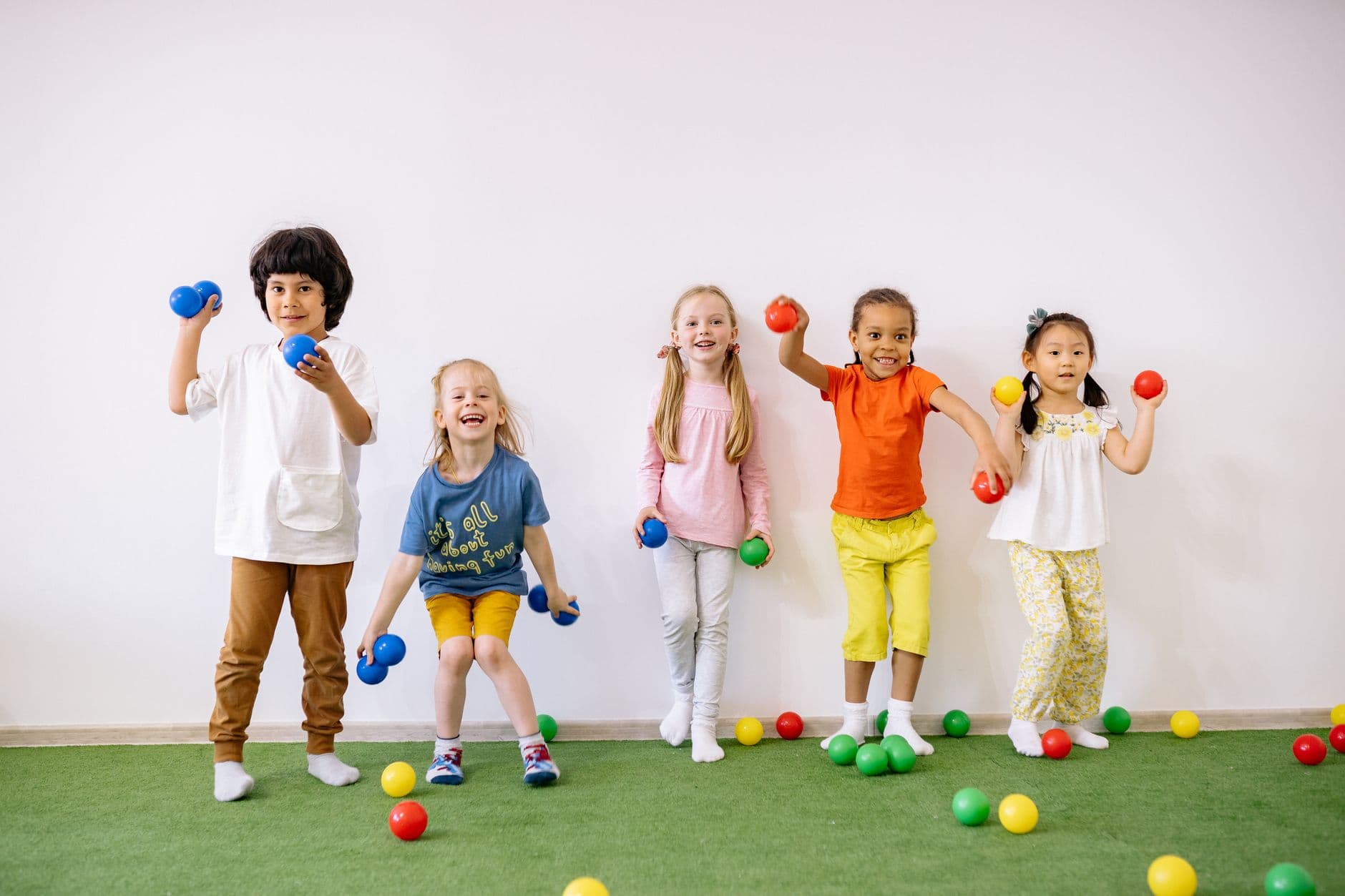 A diverse group of young children playing together