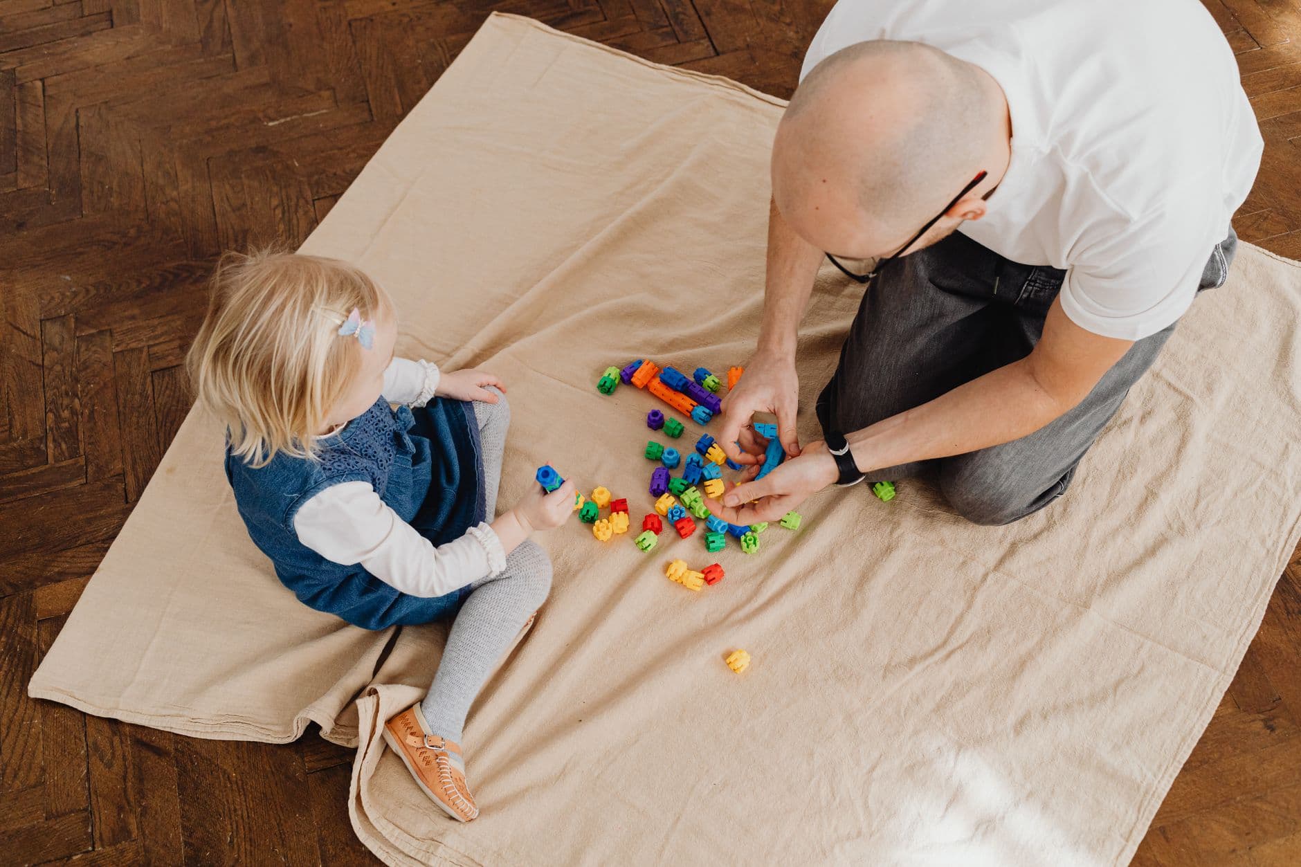 A clinician observing a child during a developmental play assessment