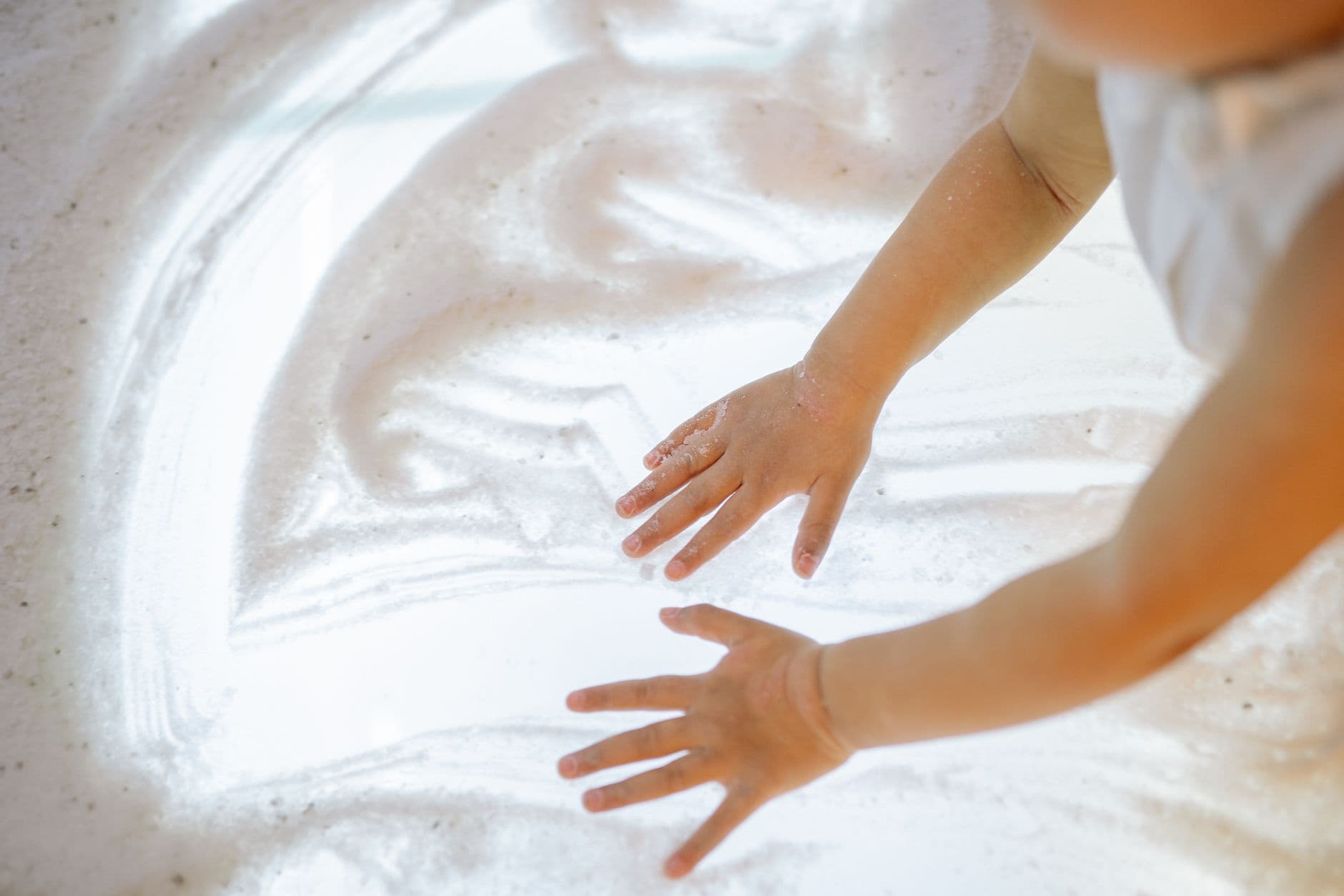 A child working with an occupational therapist on a sensory activity