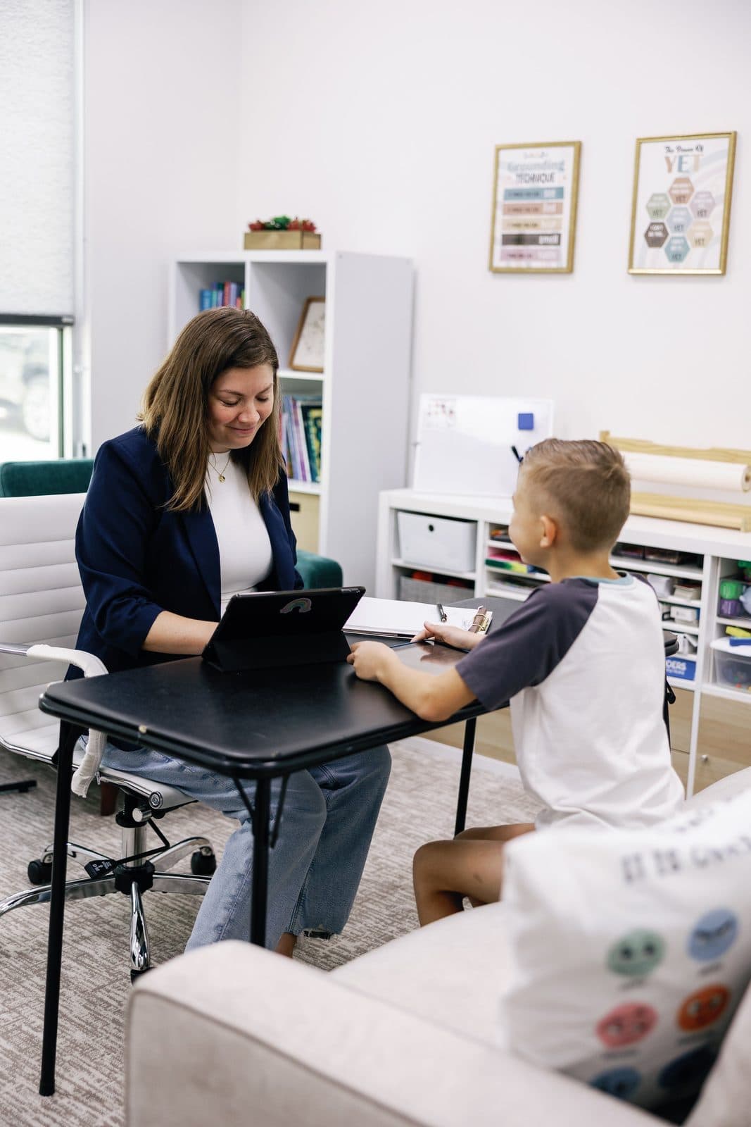 A child psychologist testing a child in her office Richmond TX