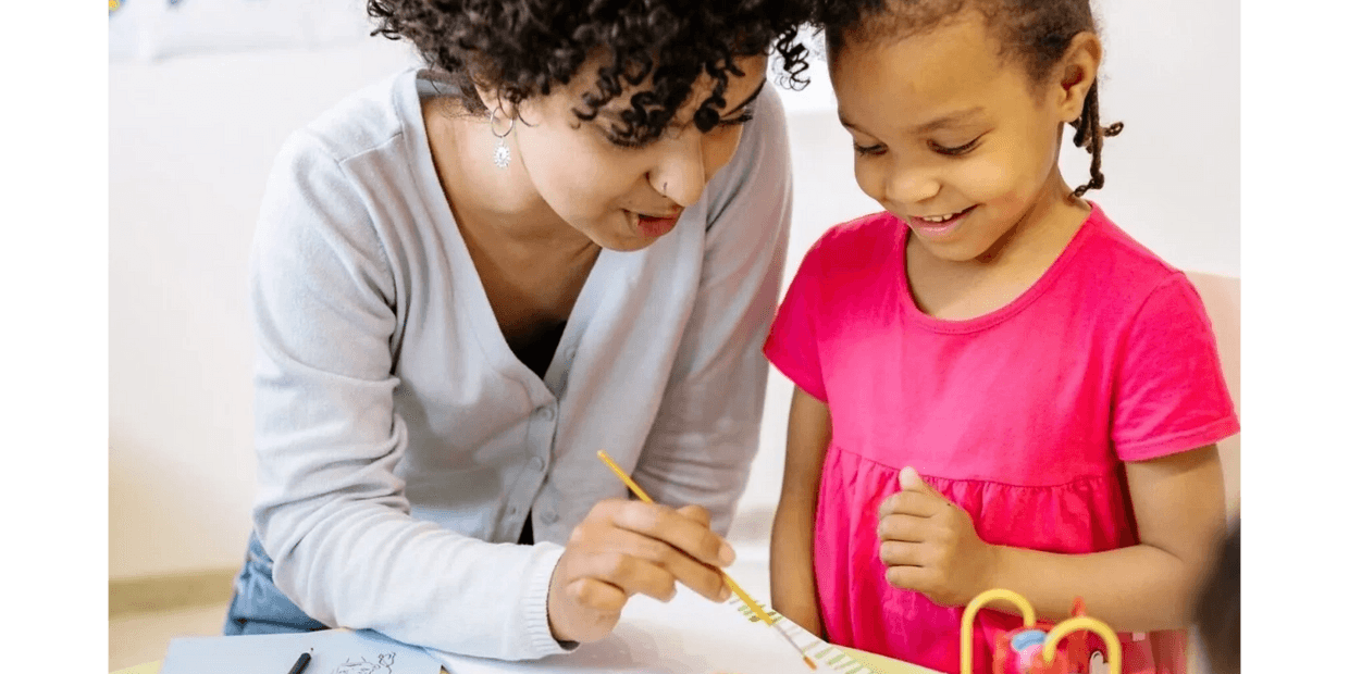 A woman and a little girl doing painting activity