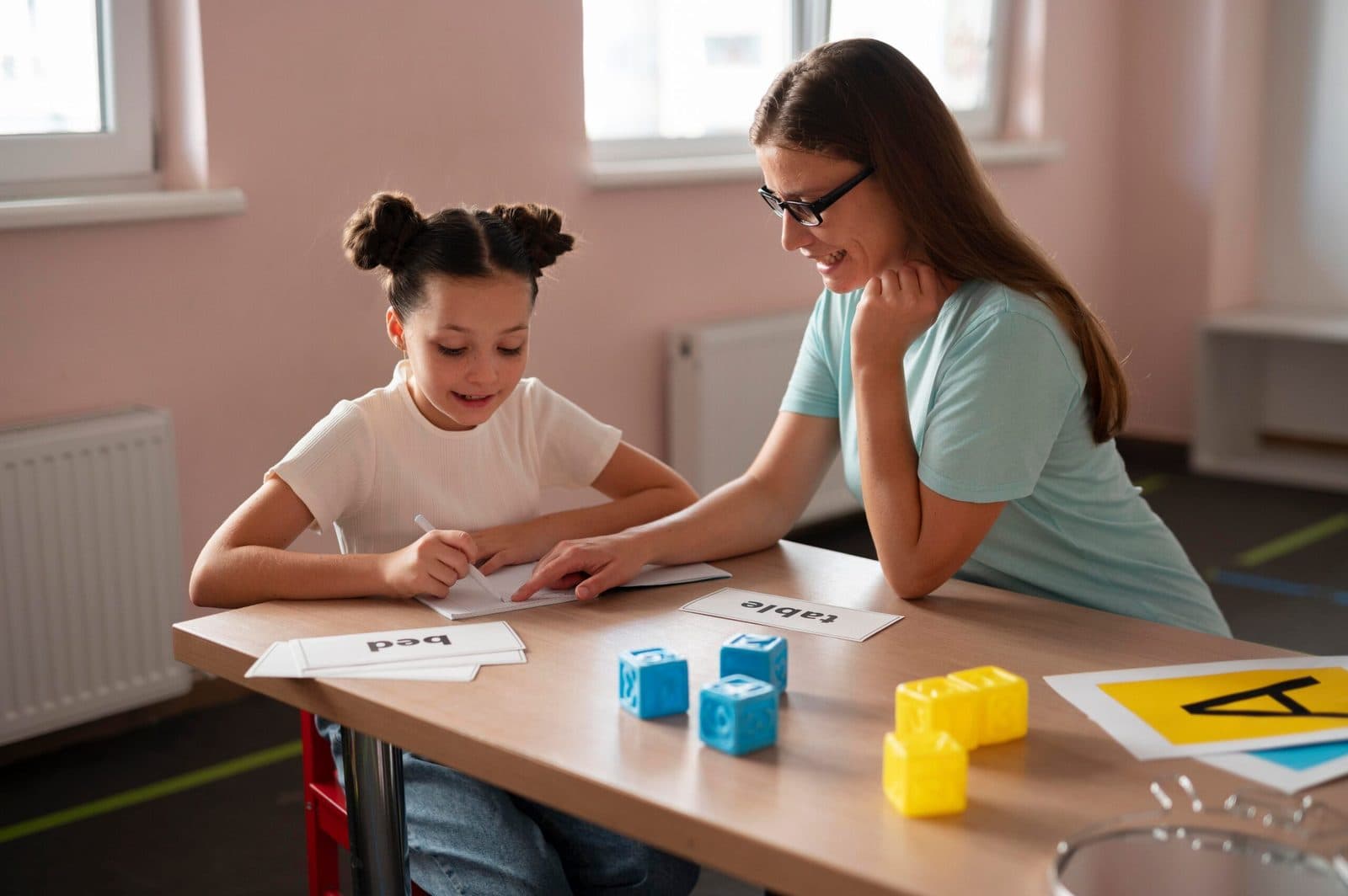 Therapist working with a young child indoors
