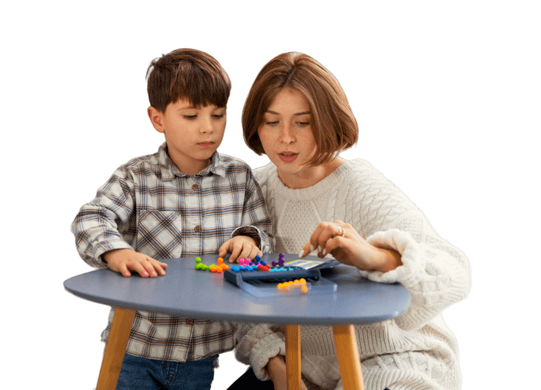 young boy playing with a woman