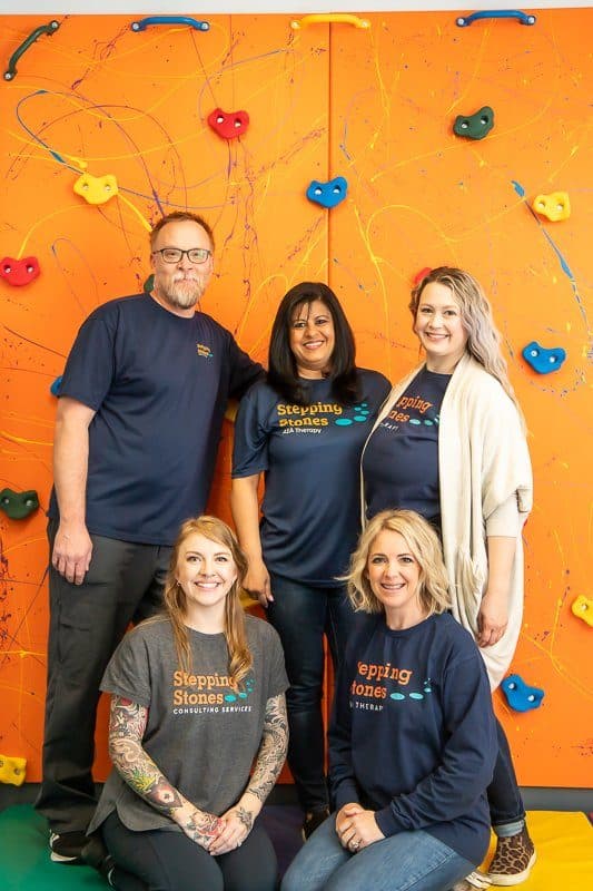 stepping stones management team smiling facing the camera
