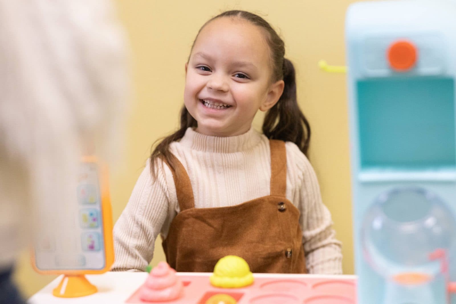 Young learners participating in ABA therapy session with colorful materials