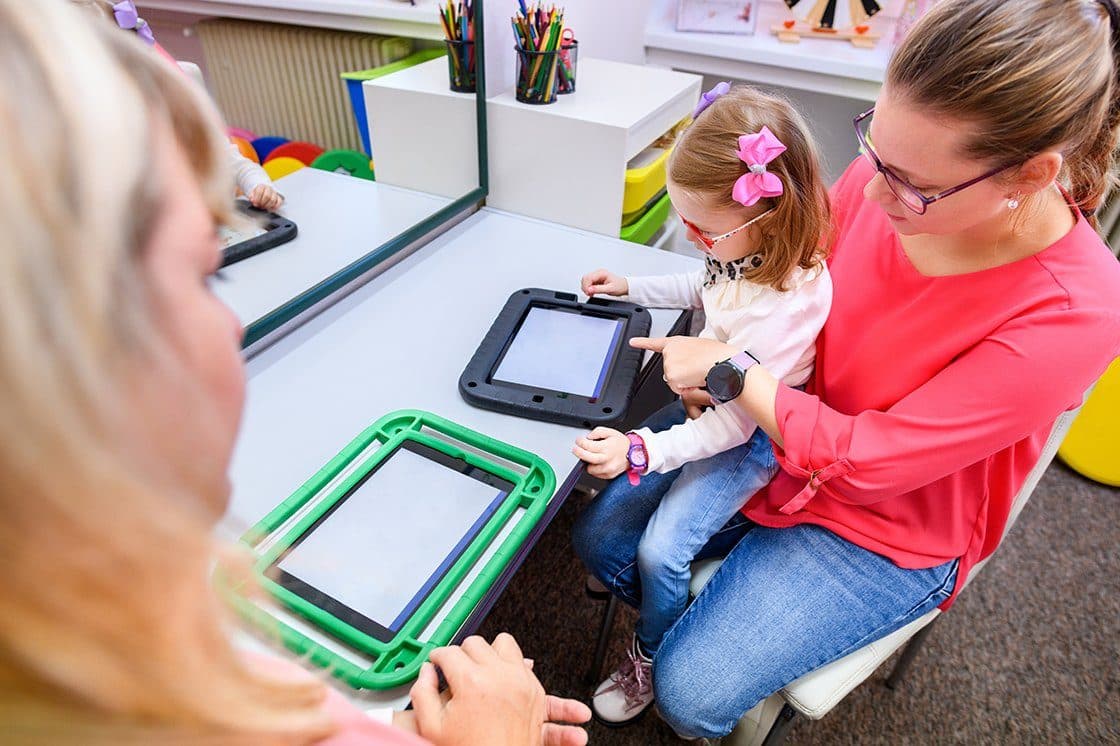 Nonverbal child receiving AAC therapy in Sugar Land, TX with Talknique