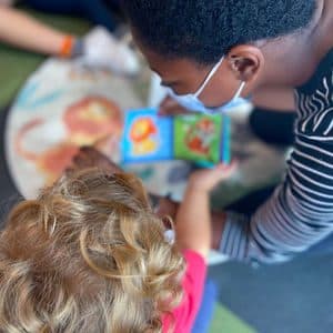 ABA therapy at One of the Kids during story time