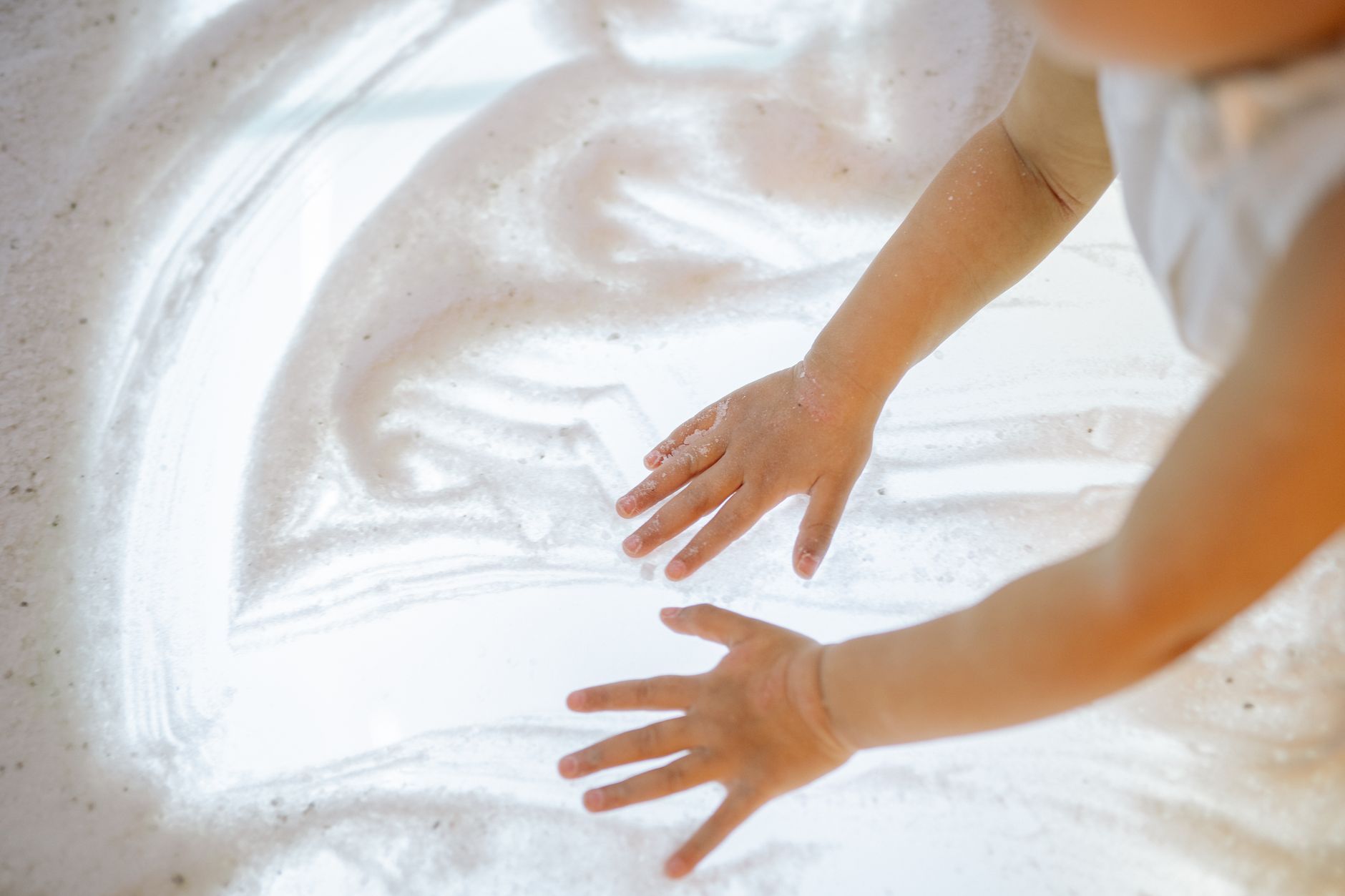 A child working with an occupational therapist on a sensory activity